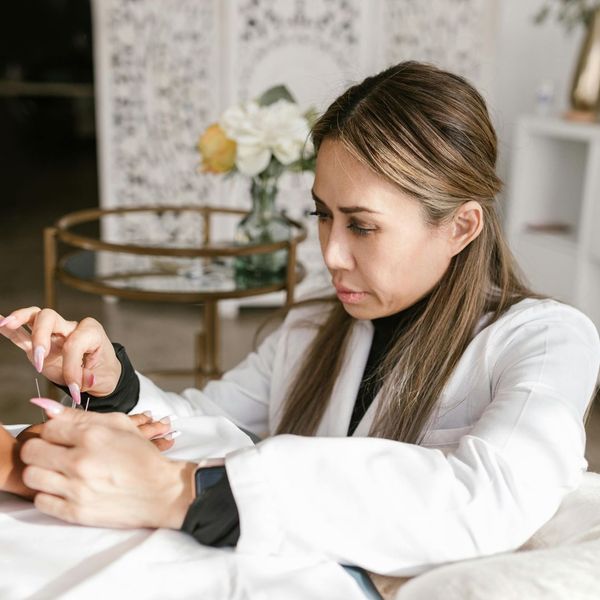 woman doing acupunture