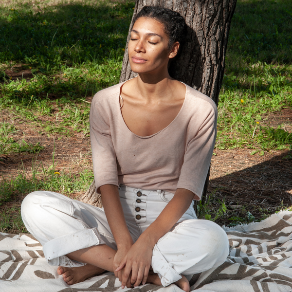 Women relaxing sitting by tree