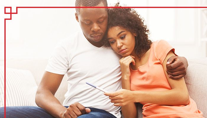 Black couple sad about pregnancy test
