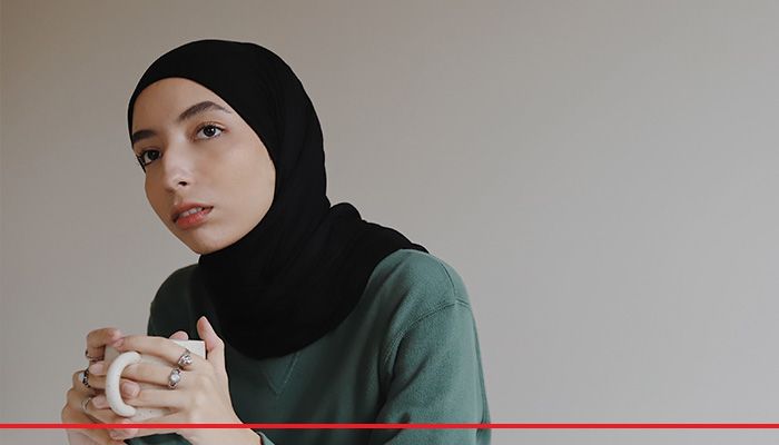 Islam woman with coffee cup