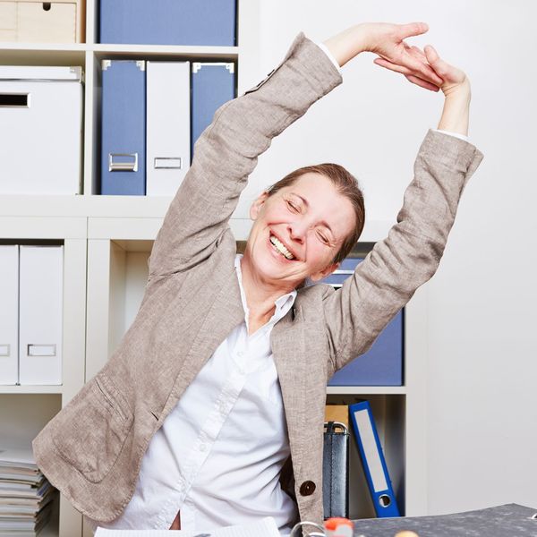 happy, pain free woman stretching