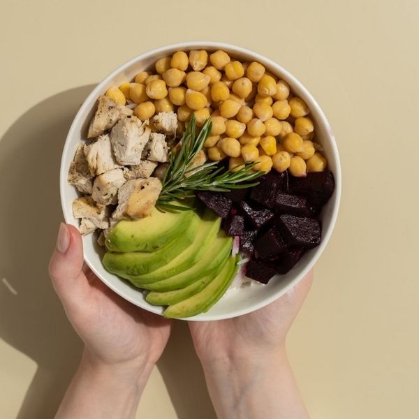 bowl with beets, chickpeas, avocado, and chicken