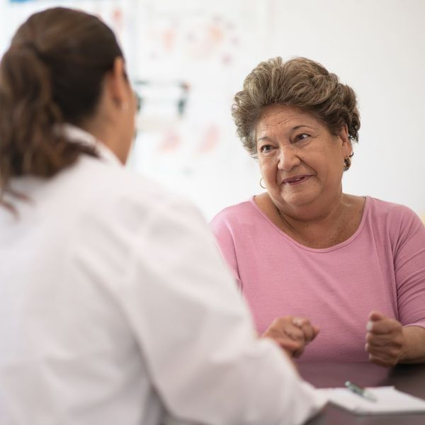 a woman talking with a doctor