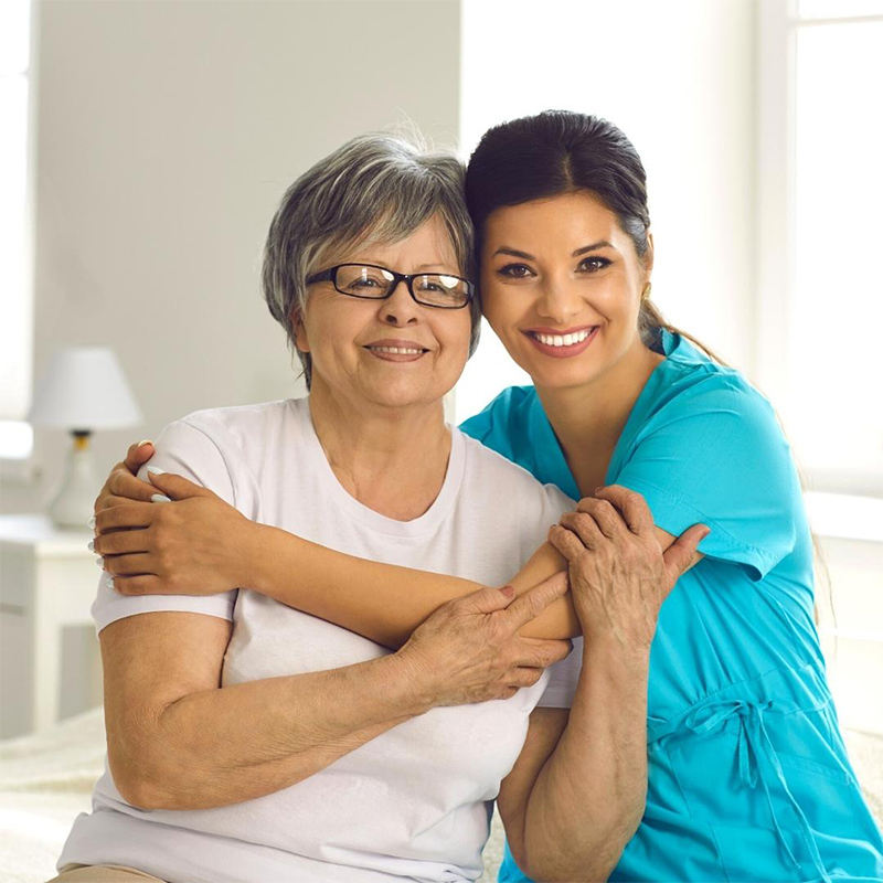 Healthcare provider hugging patient