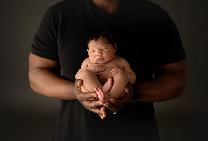 Newborn Baby in Dad's Hands | Murfreesboro Newborn Photographer