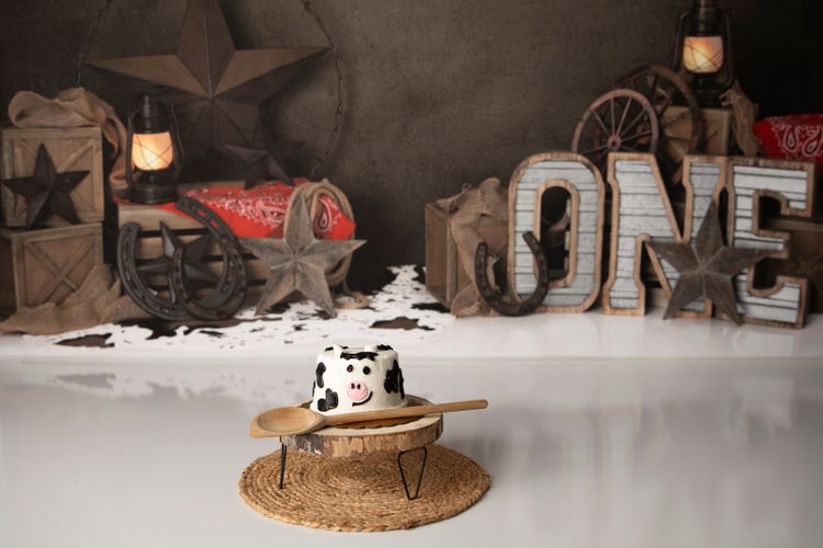 Rustic western first birthday cake smash setup