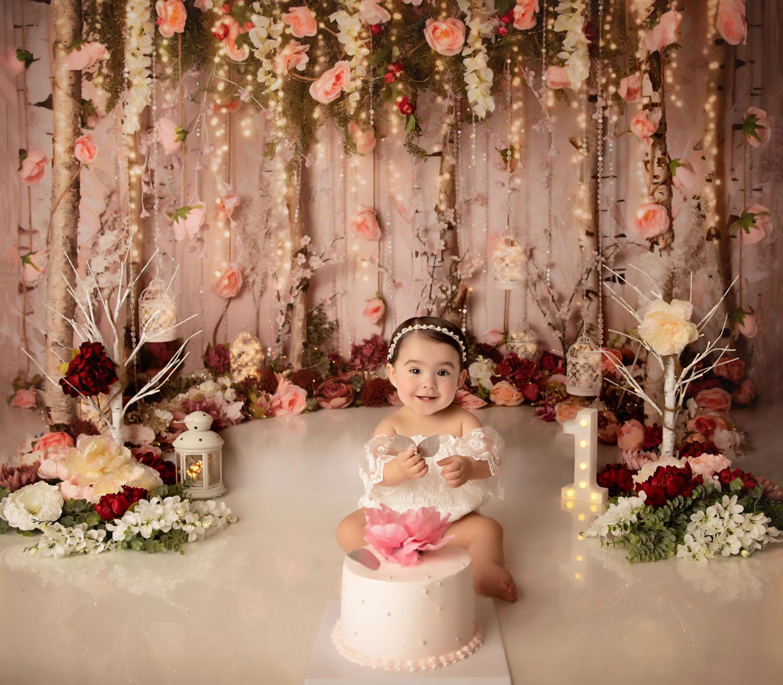 Baby girl enjoying her first birthday Smash & bath session surrounded by floral decor, photographed by Kelly Saxon Photography in Murfreesboro Tennessee. Floral Smash Cake First Birthday Session- Kelly Saxon Photography