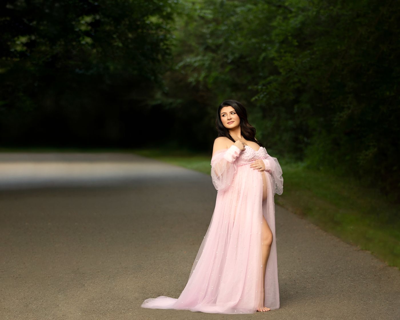 Outdoor maternity portrait of an expecting mother wearing a flowing pink gown near Murfreesboro, Tennessee, photographed by Kelly Saxon Photography. Maternity Photographer Murfreesboro TN | Kelly Saxon Photography