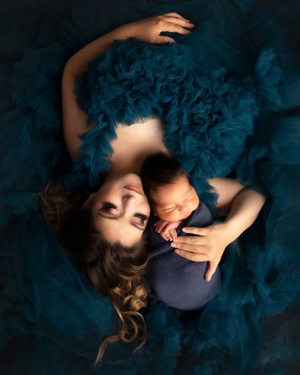Emotive newborn and mother portrait in deep blue tones by Kelly Saxon Photography, a professional newborn photographer in Murfreesboro, Tennessee. Mother and Newborn Portrait by Kelly Saxon Photography