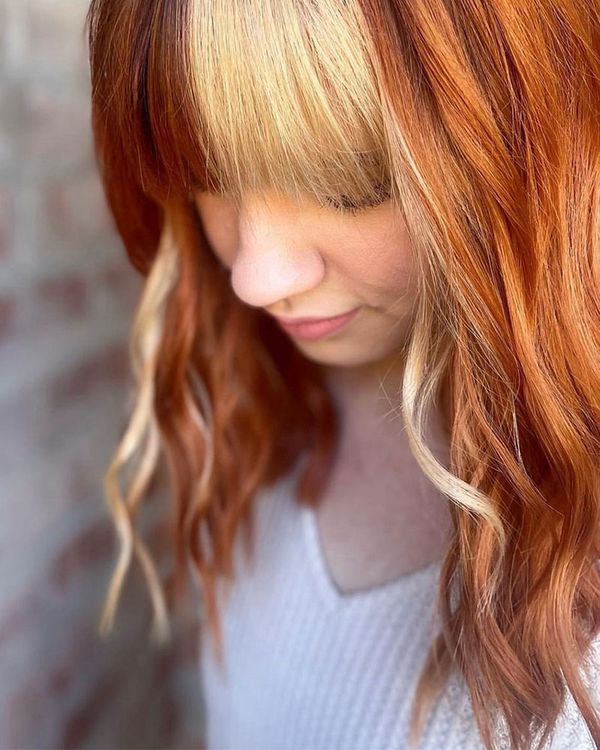 bright red orange hair with blond face framing and bangs