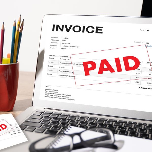 Paid invoice on a laptop