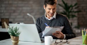 image of a business owner getting their taxes ready