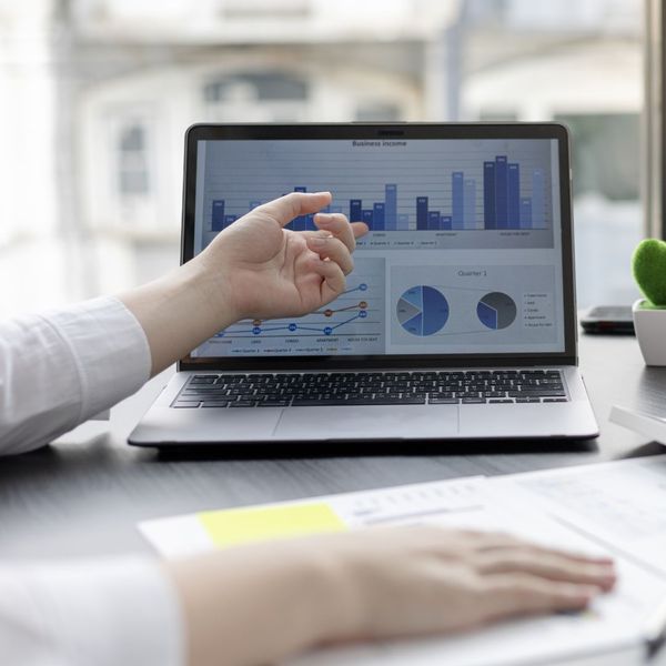 looking at financial information on laptop looking at financial information on laptop