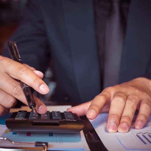 man using calculator
