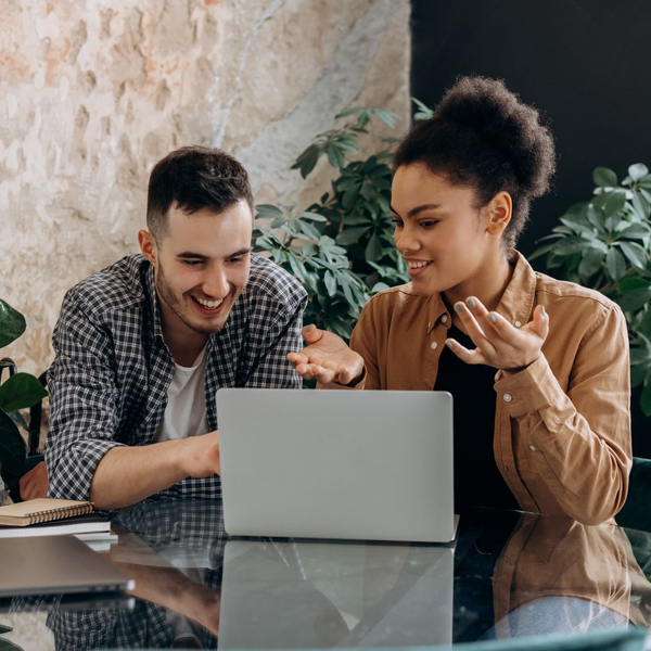 Two people looking at laptop Two people looking at laptop