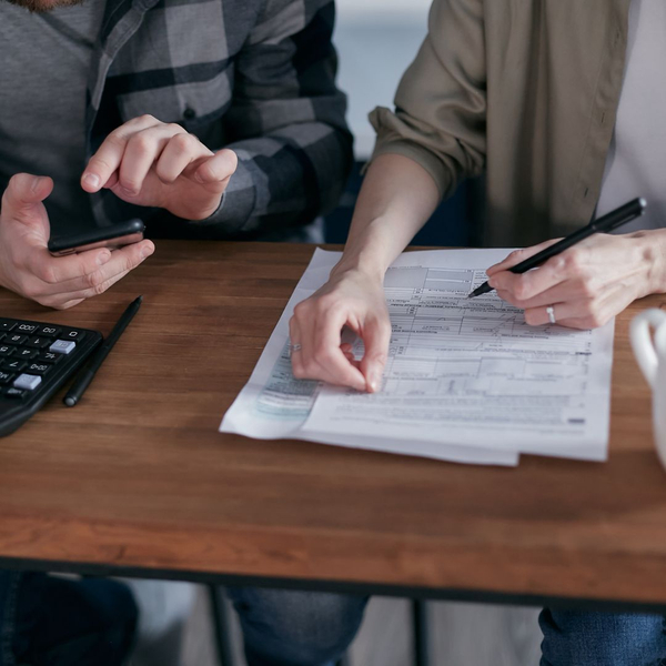 two people doing taxes two people doing taxes
