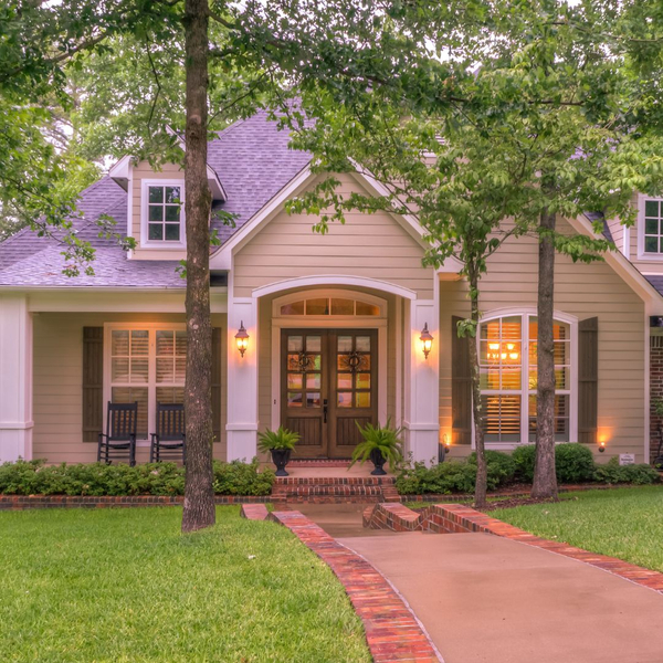 Front of home with the lights on Front of home with the lights on