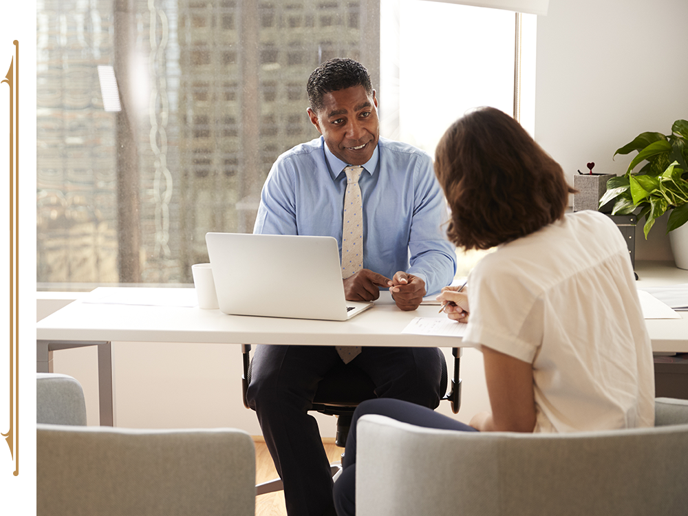 Lawyer smiling in a meeting with a client