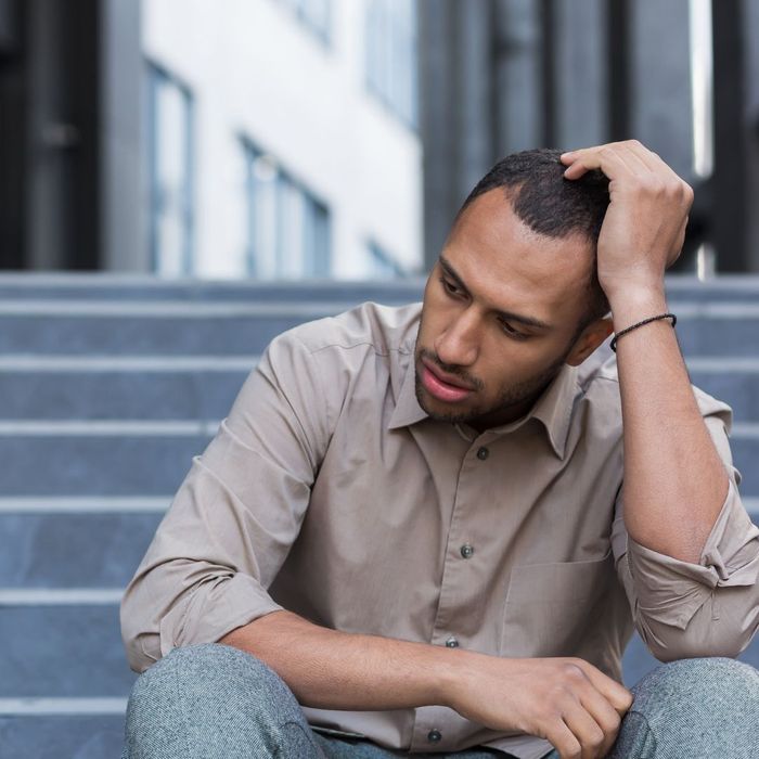 sad man sitting on steps