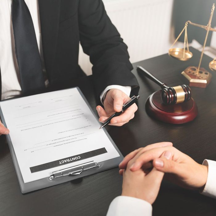 lawyer reviewing contract with client