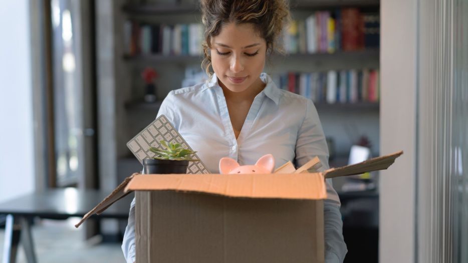 woman packing up desk