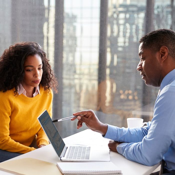 lawyer and client looking at laptop