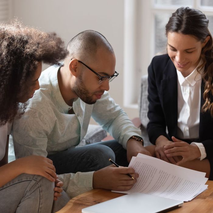 Lawyer and clients looking at documents