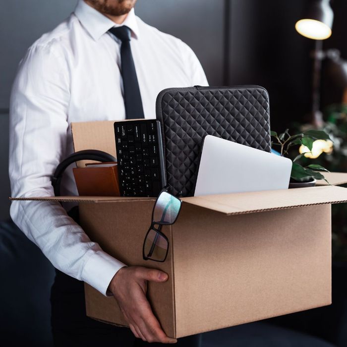 man with box of belongings