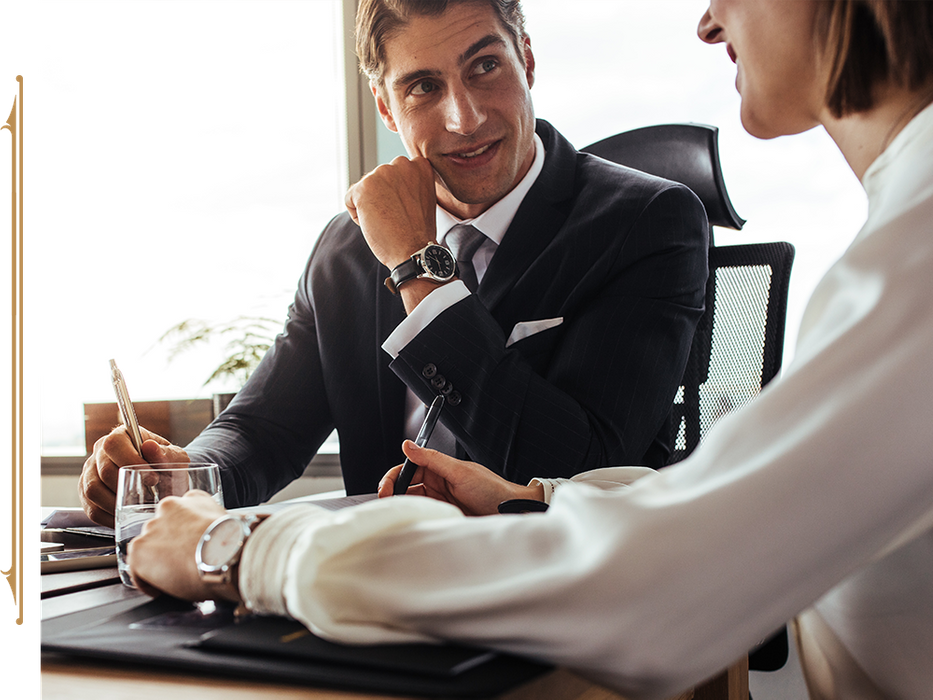 Lawyer smiling in a meeting with a client