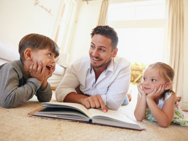 Dad reading with kids