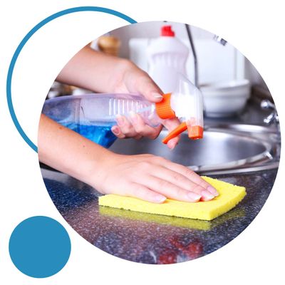 person cleaning counter