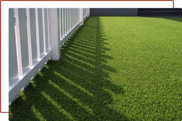 turf and a white fence