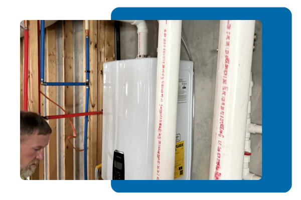 Employee looking at a residential water heater