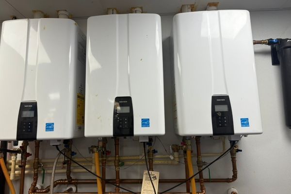 Three tankless water heaters