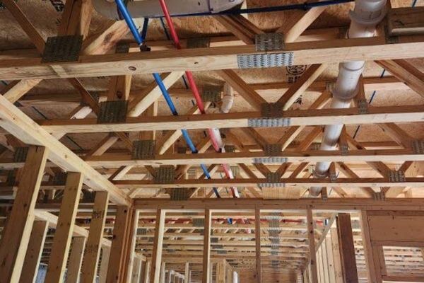 Pipes along the framing of a residential home