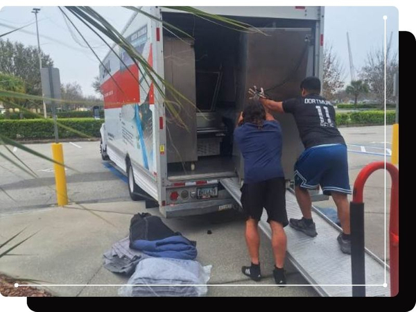 Movers moving items into a truck Residential Moving (3).jpg