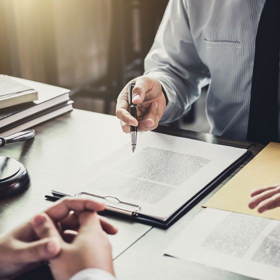 image of  someone pointing at paperwork