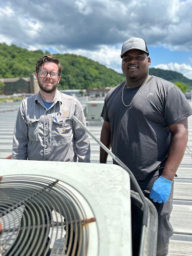 Image of two employees working