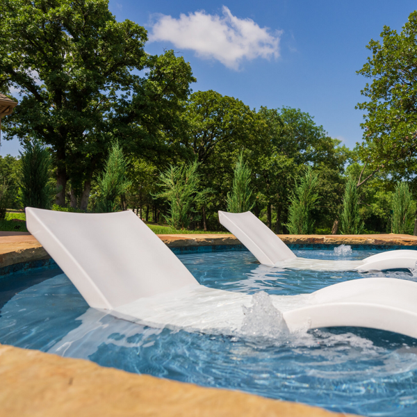 Two chairs inside a pool