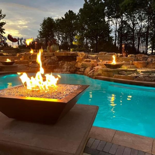 custom pool with fire bowls