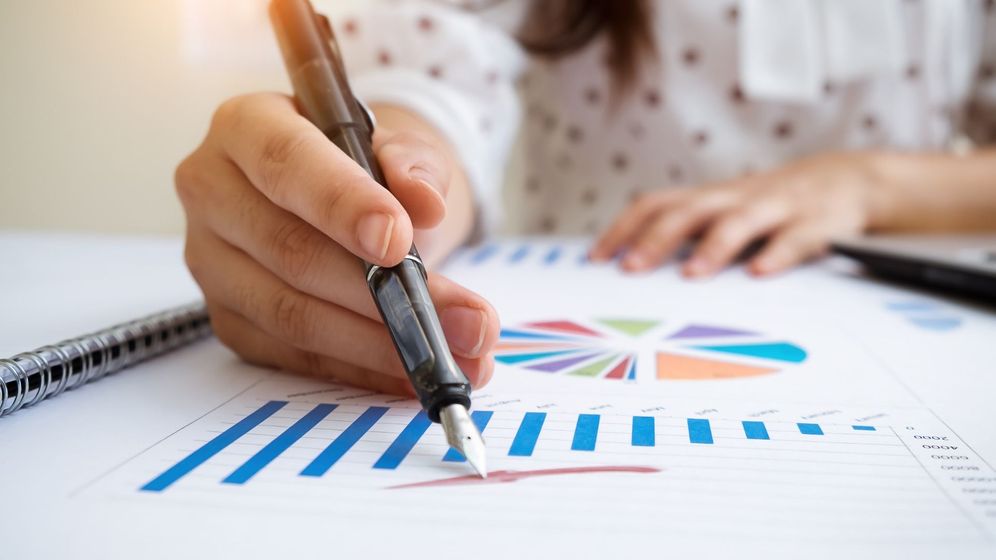 person looking at charts