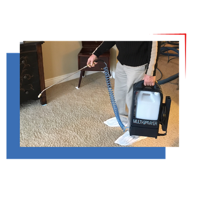 man cleaning carpets with sprayer