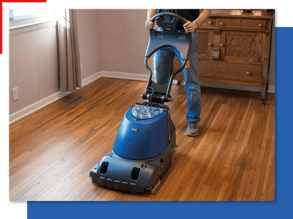 Person cleaning hardwood floors