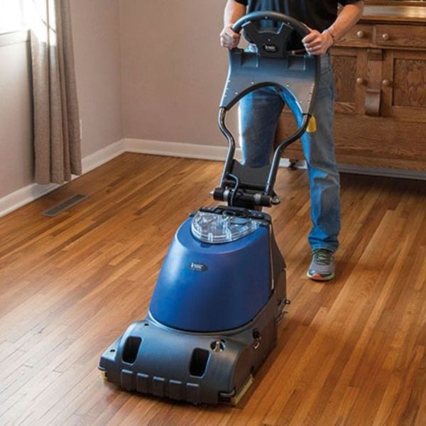 person cleaning hard wood floors