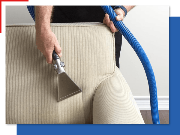 Man cleaning the back of a couch