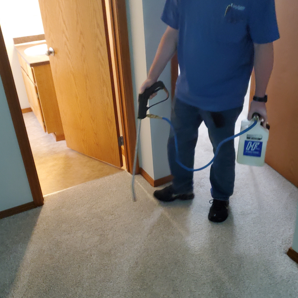 Carpet spray being applied