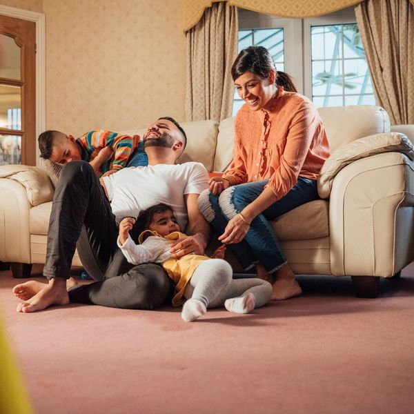 family playing on the carpet