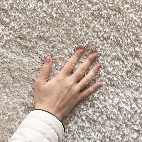 hand on clean carpet