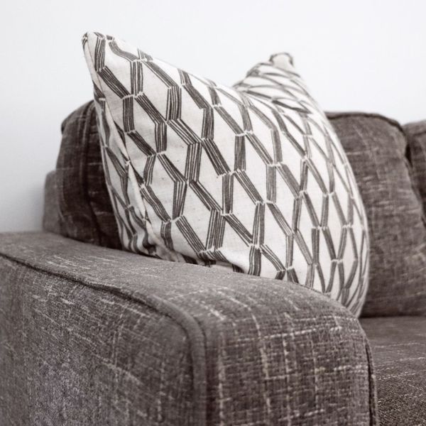 Heathered Grey Couch with Pillow How To Find A Reliable Upholstery Cleaning Service2.jpg