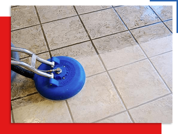 Person using machine to clean tile floors